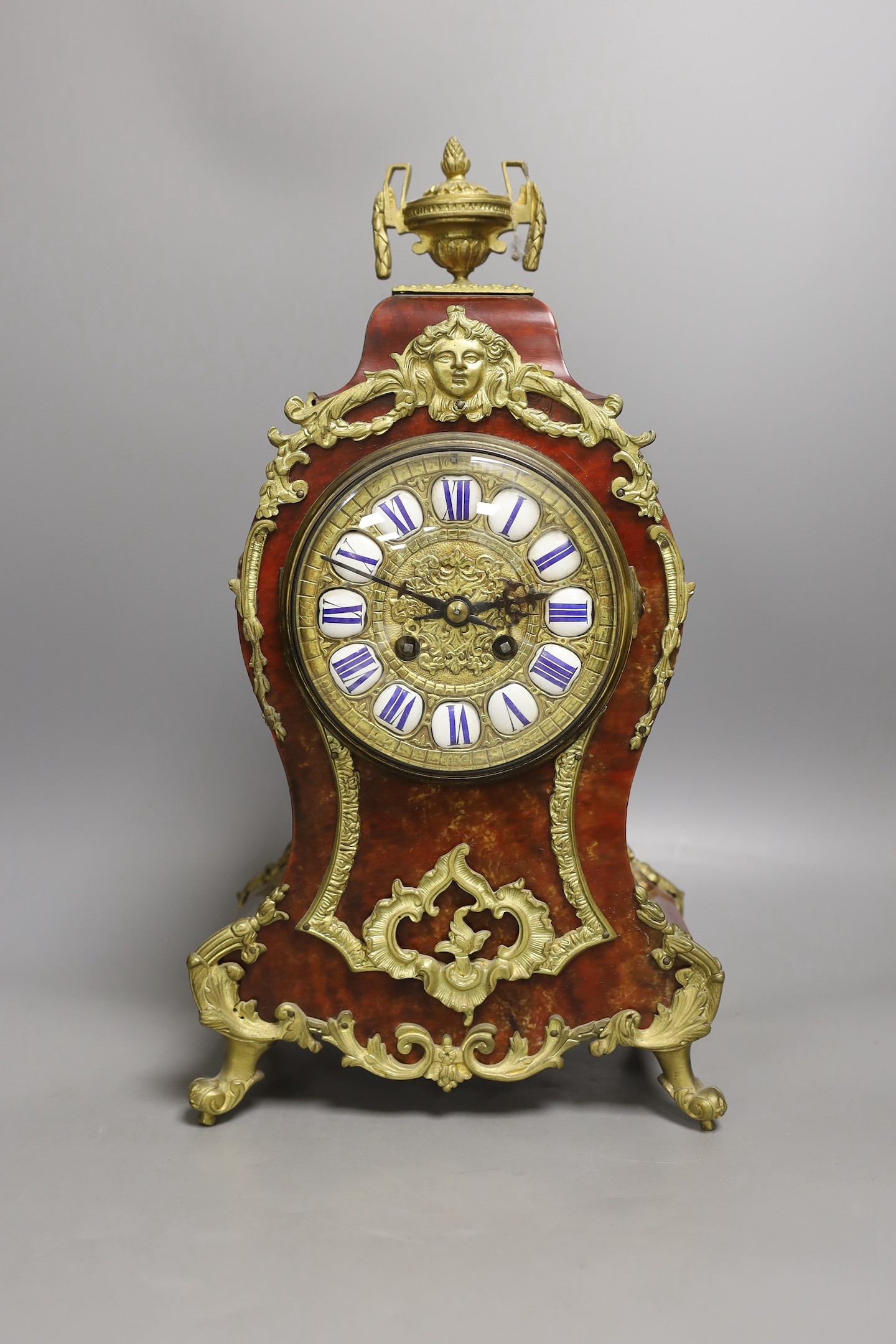 A late 19th century French scarlet tortoiseshell and ormolu mounted mantel clock - 40cm tall